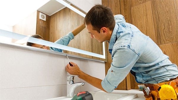 Man installing bathroom