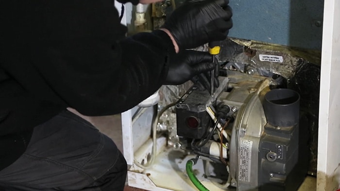 engineer working on a boiler Mcroberts repairs boilers