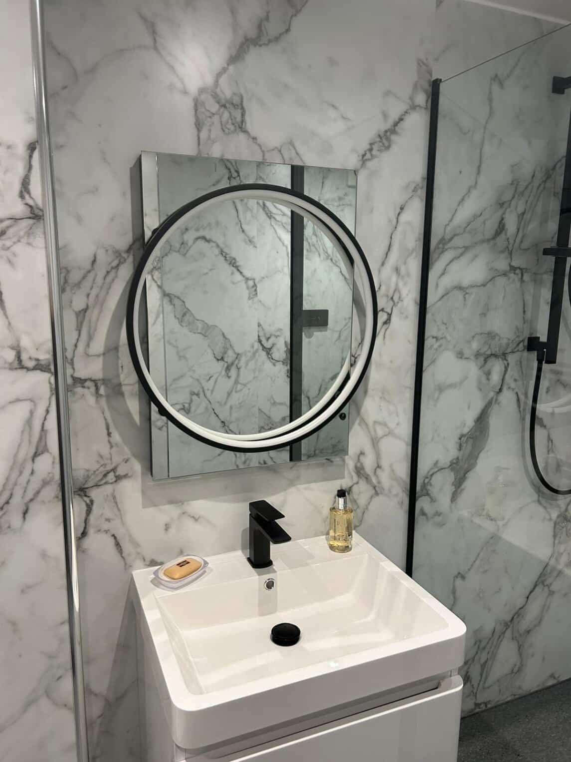 stewart 2 New bathroom sink and mirror fitted by Mcroberts