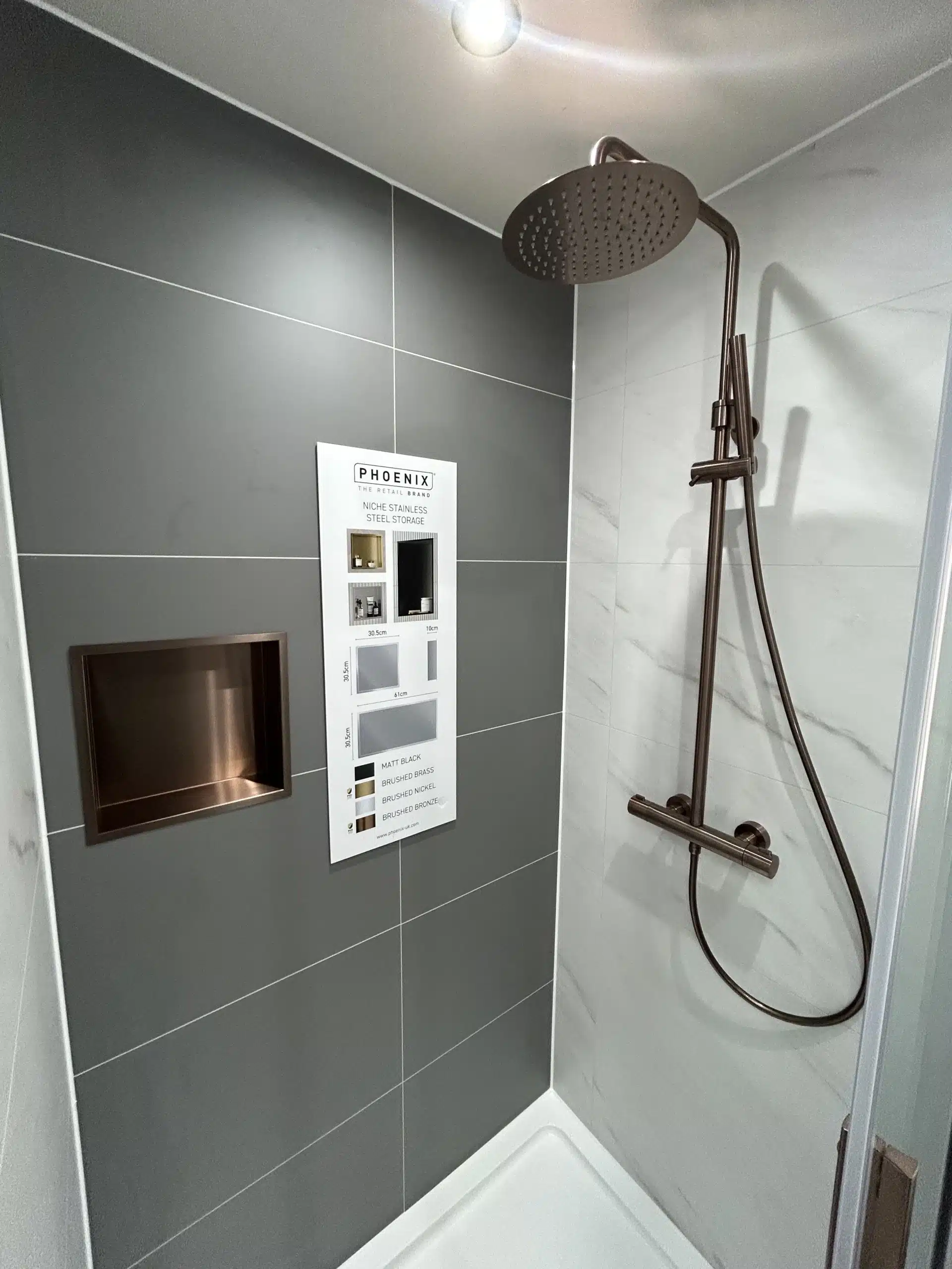 chrome shower in a luxury bathroom with grey wall panels
