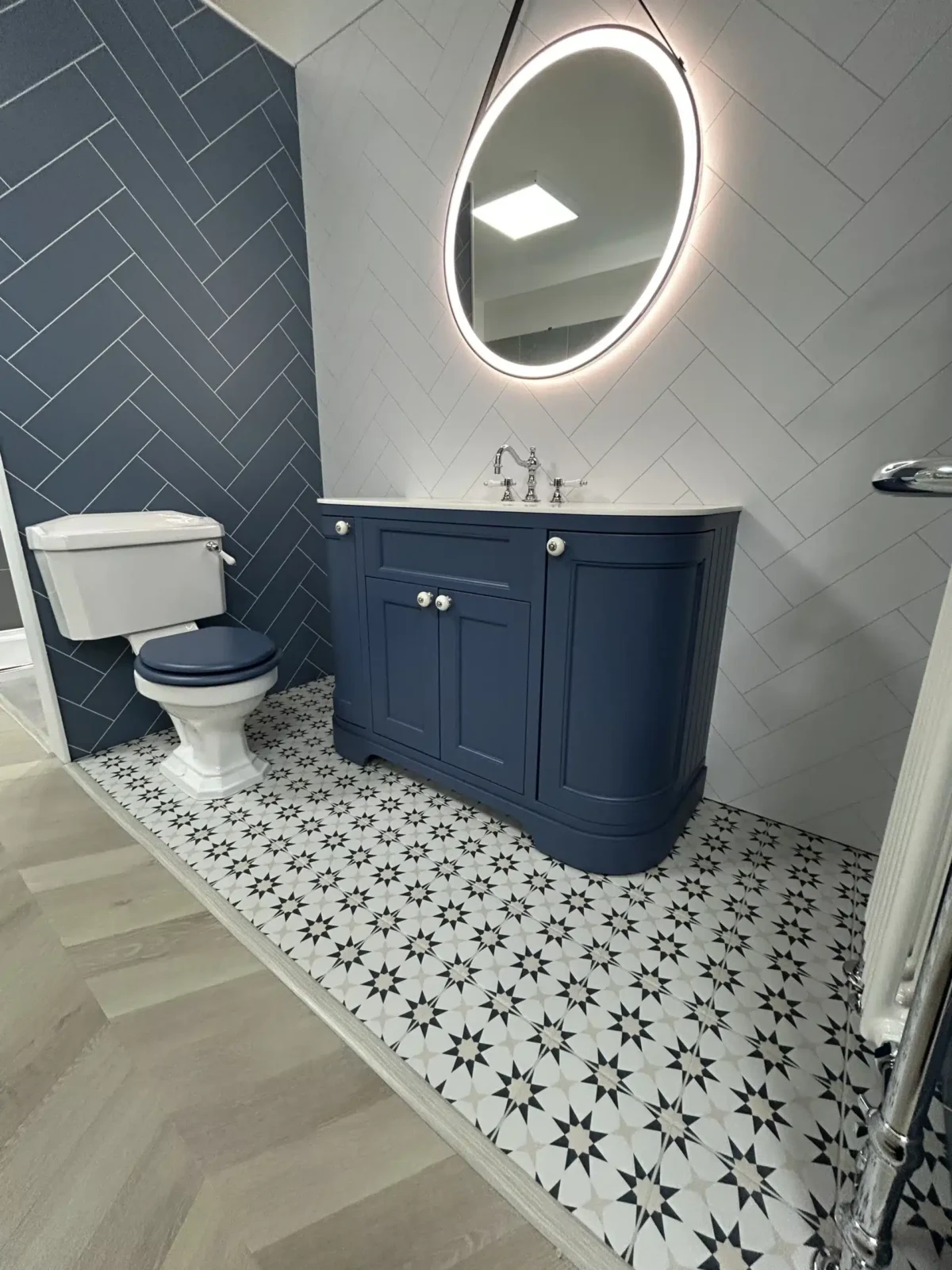 modern bathroom with unique tiling and dark blue colouring